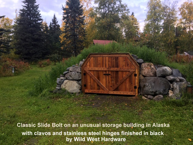 Our Classic Slide Bolt, clavos and stainless steel hinges on an unusual storage building - Wild West Hardware