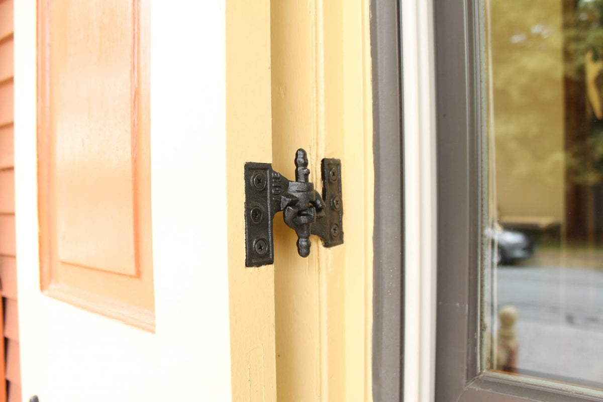 Black Acme Mortise Shutter Hinges Installed on a White Shutter