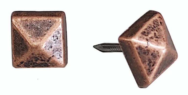 2 pyramid-shaped decorative nails with a copper finish.