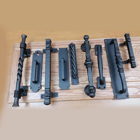 Assorted barn door handles with different designs and finishes, displayed on a white background.