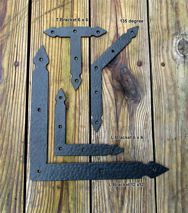 A photo of two L brackets, one T bracket, and one 135-degree bracket.
