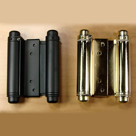 Double action spring hinges measuring 4 inches and available in matte black and brass finishes, displayed on a white background.