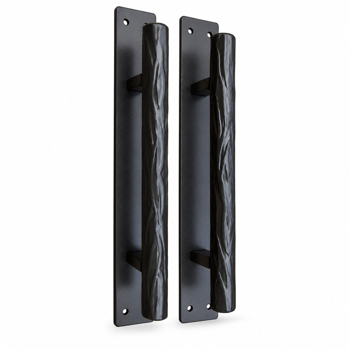 Pair of tree branch style door handles on a white background