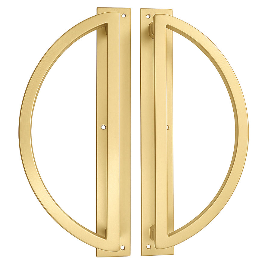 Pair of gold door handles on a white background