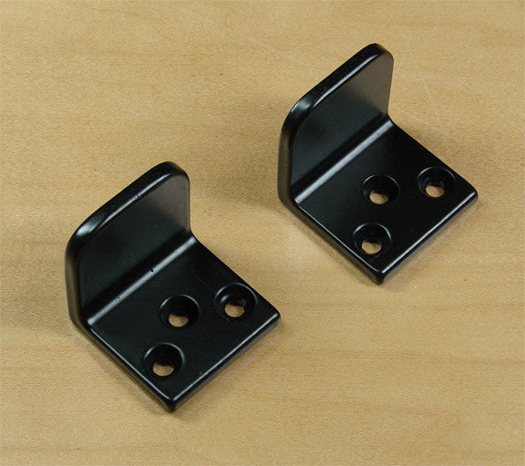 A pair of gate stops made of black iron, used to prevent gates from swinging too far, displayed on a white background.