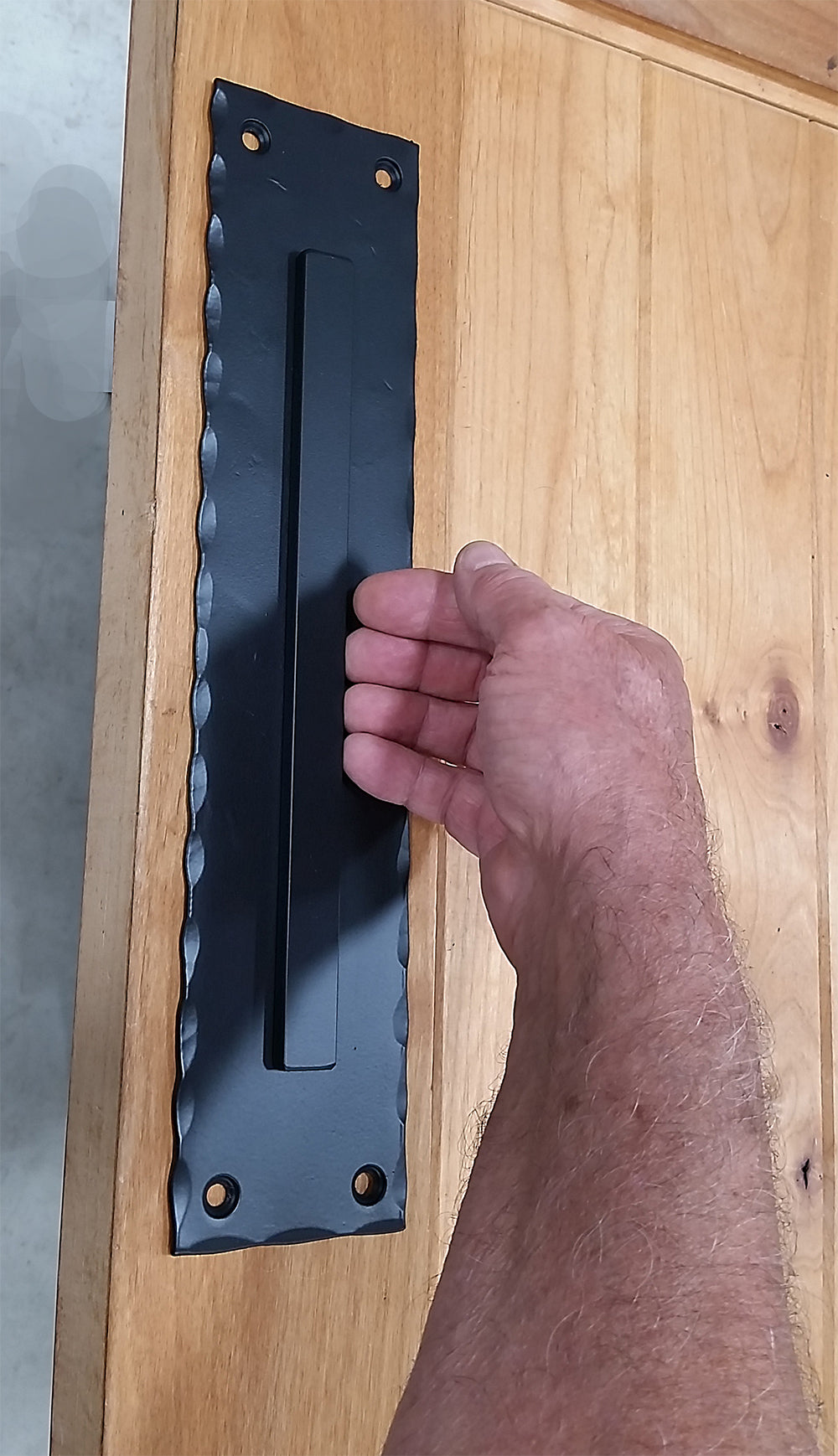 Large_flush_finger_pull_hammered_edges_hand